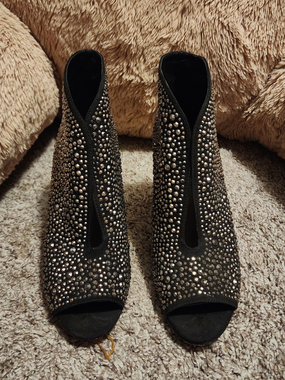 Ankle boots with sparkling embellishments by INC International Concepts.